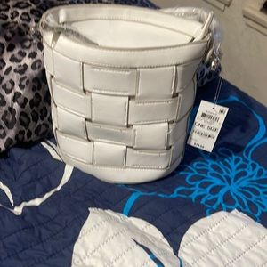 24” all around. Makes a round purse. Alfani bangle purse. Got at Ross. Very cute